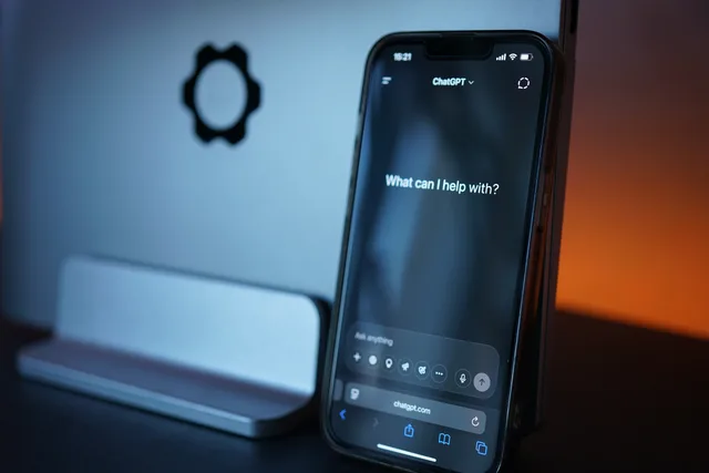 Close-up of a smartphone with AI chat interface, showcasing advanced technology in a sleek design. AI chatbots for marketing: what UK brands should know