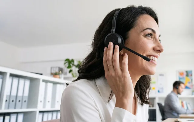 office, headset, smiling woman, headset microphone, workplace, interaction, call center, conversation, professional, communication, customer service, woman, smile, white shirt, satisfaction, working, happy worker, administrative, telephone call. What do Cambridge AI vendors offer UK B2B marketing teams?